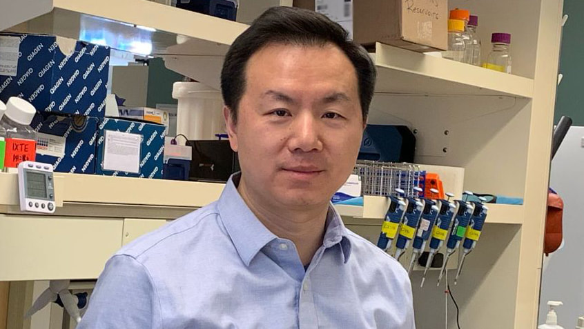 Feng Yue, PhD in lab