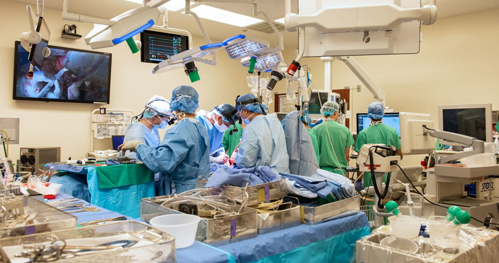 Image of Dr. Ankit Bharat and team operating on patient in the surgery room. 