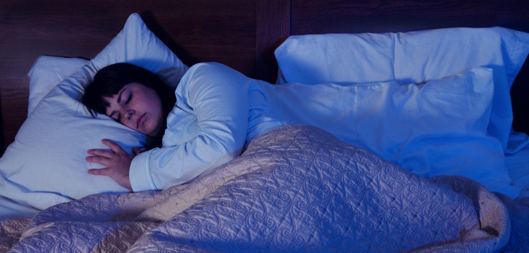 Person sleeping with artificial light on