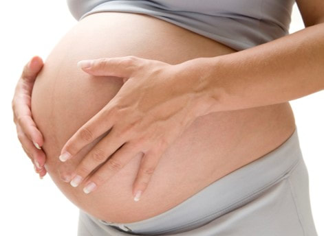 Pregnant women with hands on stomach